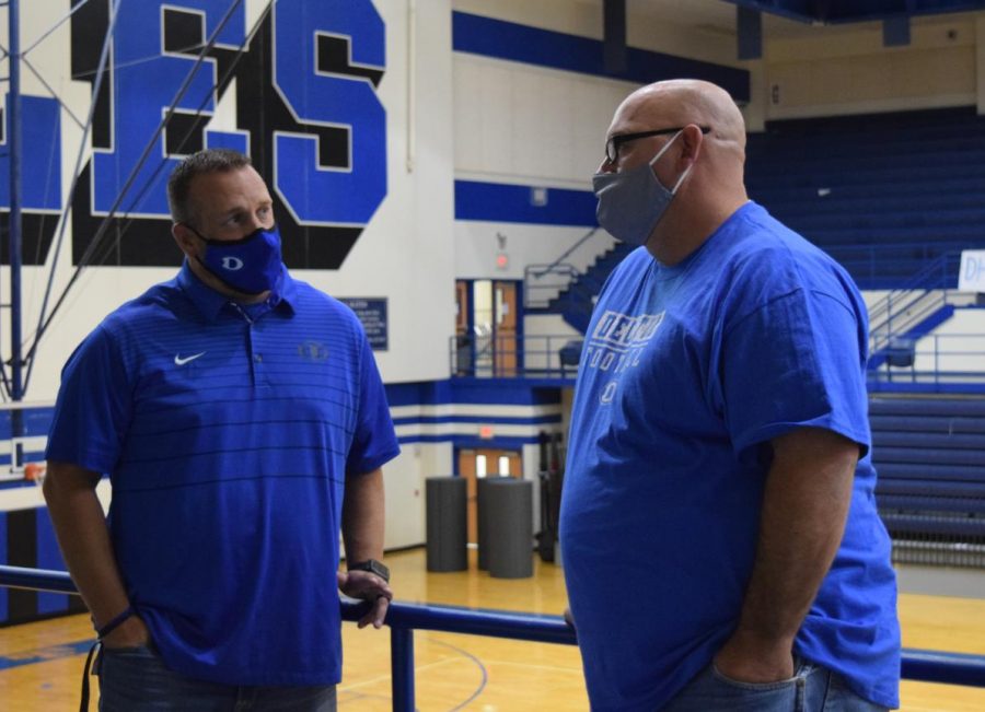 Associate Principal Brett Phipps catches up with Coach Kevin Thomas during the lunch rotation on September 11. 