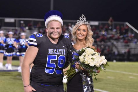 Homecoming King, Hayden Philpot, and Homecoming Queen, Libby Ragsdale, pose during half-time after being crowned.