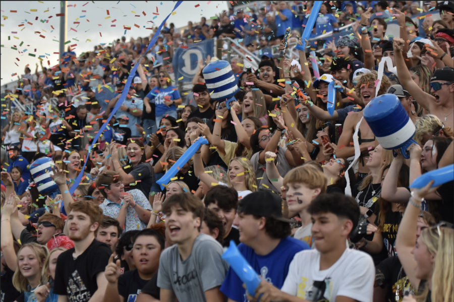 The+DHS+student+section+cheers+on+the+Eagles+varsity+football+as+they+compete+at+their+home+stadium.