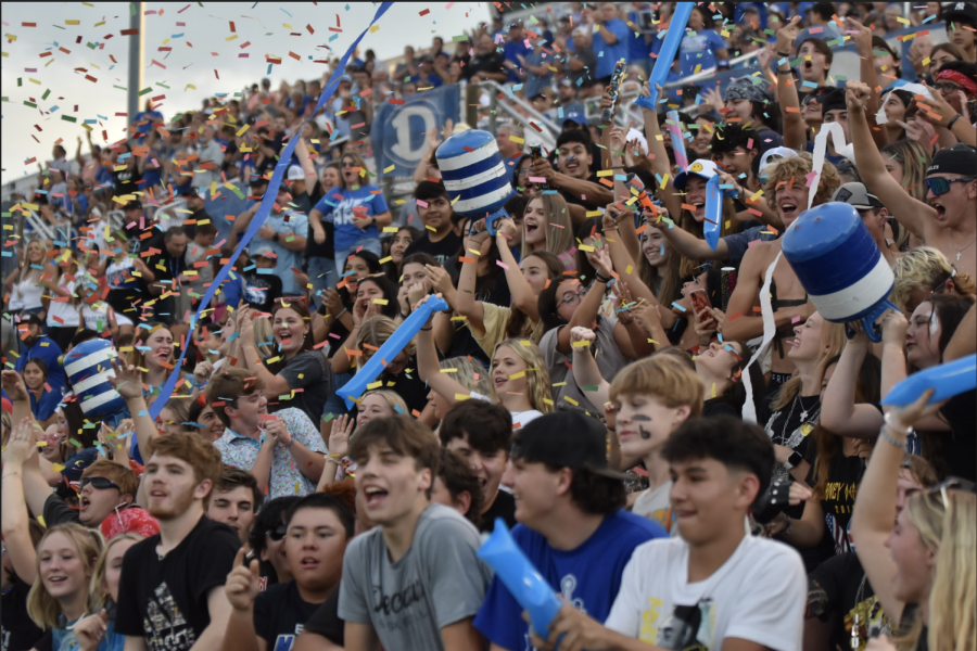 The DHS student section cheers on the Eagles varsity football as they compete at their home stadium.